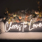 Raise a glass to love with the Cheers To Love wedding neon sign from ManhattanNeons.com, adding a celebratory glow to your big day